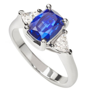 The Lyric Ring - Cushion shape Sapphire with trilliant diamond sides in platinum
