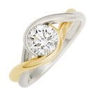 Brown Goldsmiths own Embrace ring is our Signature two tone of Platinum and 18k yellow gold with a diamond