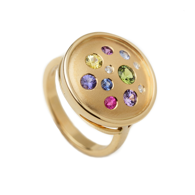 fancy color sapphire round galaxy ring from the Brown Goldsmiths Signature Ring Collection