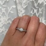 Round Diamond, baguette accents with round accents Closed Hand