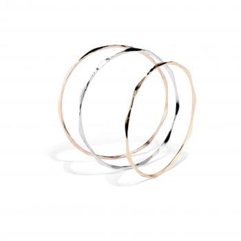 Ripple bangles shown in rose gold, white gold, and yellow gold