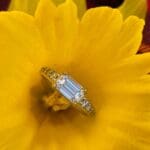 Platinum Emerald cut diamond New Horizon in yellow flower