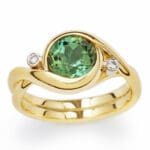 Embrace - Yellow gold with a green tourmaline and two accent diamonds.