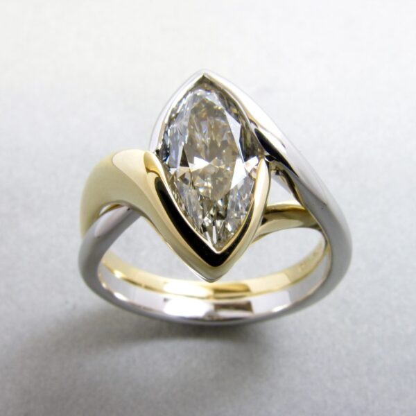 Embrace - Customized for a Marquise shape diamond in Platinum and 18k yellow gold.