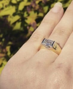 Brown Goldsmiths Horizon Ring with an Emerald cut diamond