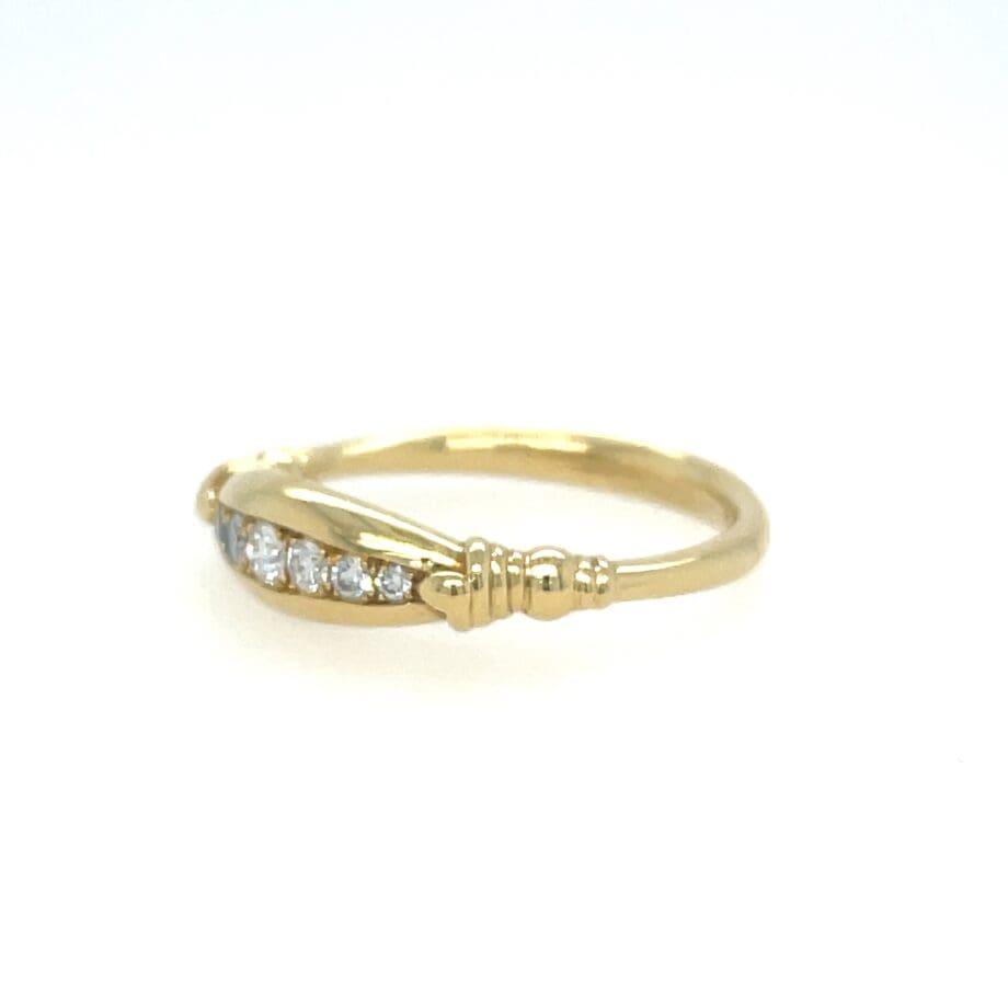 Tapered Diamond Channel band in yellow gold Side View