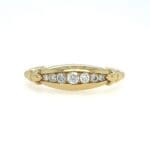 Tapered Diamond Channel band in yellow gold