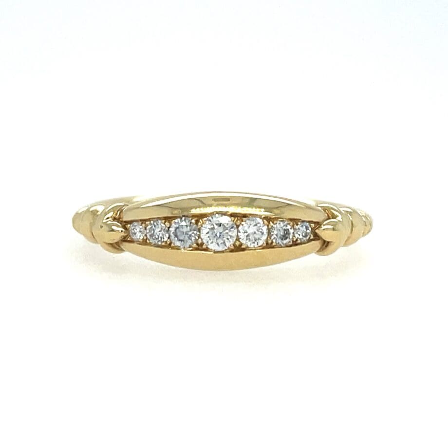 Tapered Diamond Channel band in yellow gold