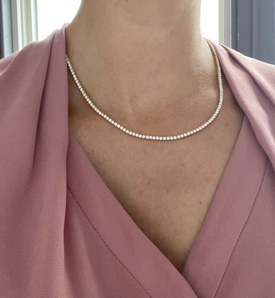 Diamond tennis necklace or Riviera Necklace in 14kY on model.