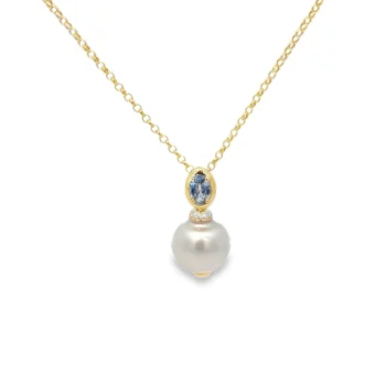 Sapphire And Pearl Drop Pendant Necklace with accenting diamonds all in 14k yellow gold on an 18" rolo style chain.