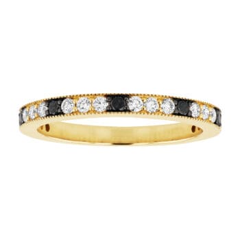 14K yellow gold diamond band with alternating white and black diamonds in a shared prong setting, detailed with milgrain edging.