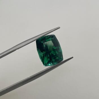 Maine Green Tourmaline in tweezers