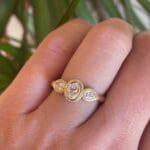 D6076 Three Diamond Ring with Oval and Pear Shapes