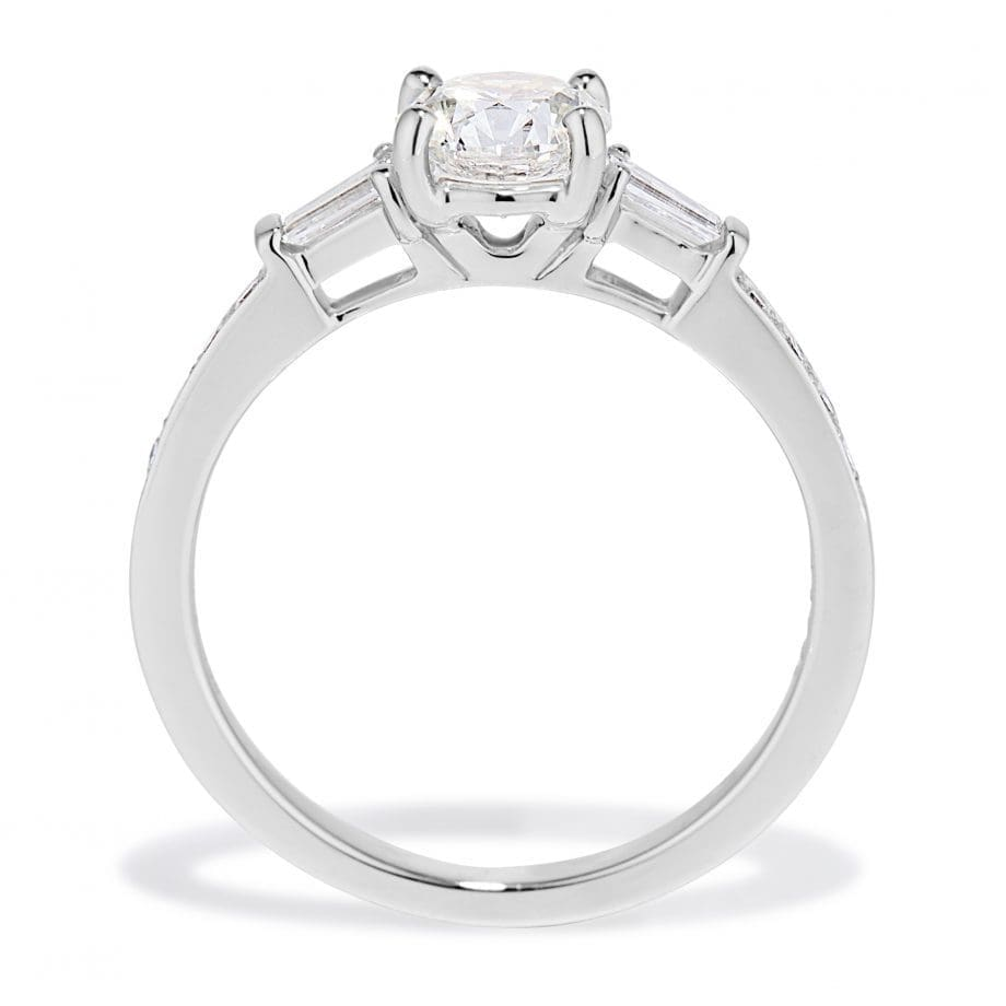 Platinum engagement ring with an 0.80 carat round center diamond and baguette side diamonds