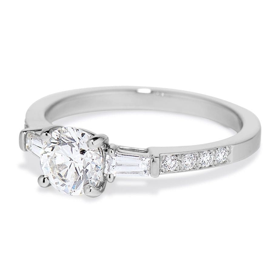 Platinum engagement ring with an 0.80 carat round center diamond and baguette side diamonds