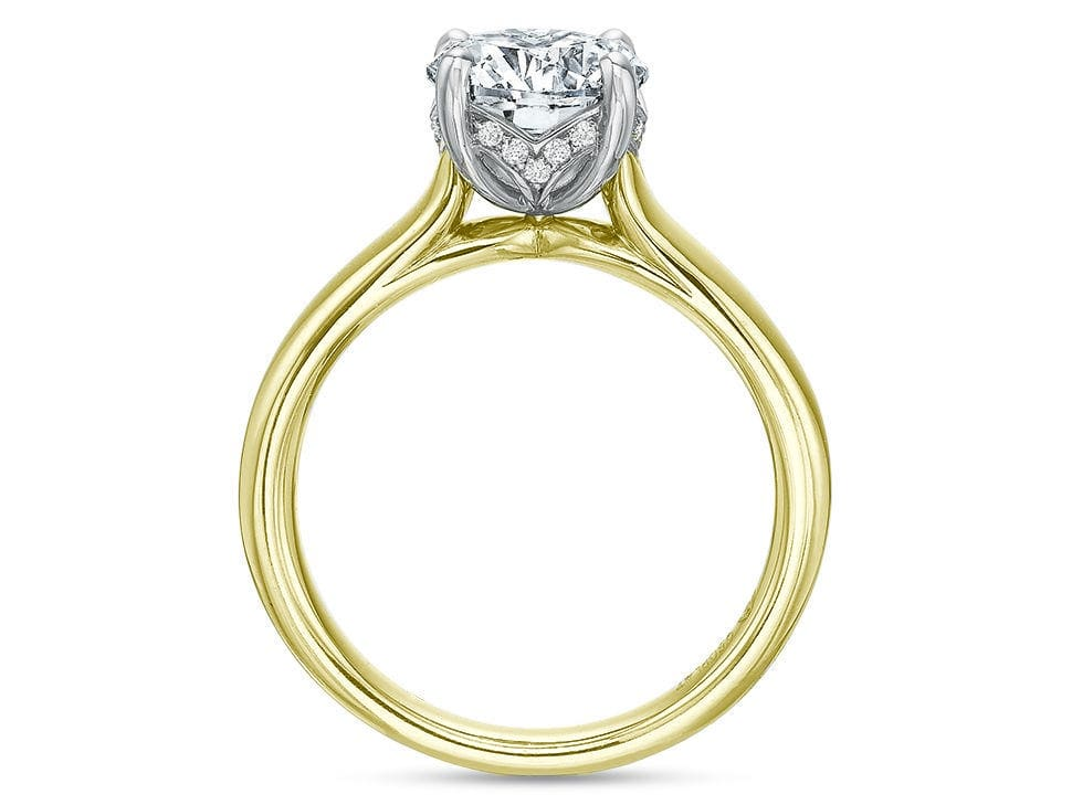 Round diamond solitaire engagement ring in 18K yellow gold band with platinum diamond setting