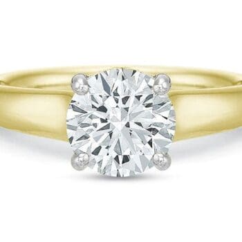 Round diamond solitaire engagement ring in 18K yellow gold band with platinum diamond setting