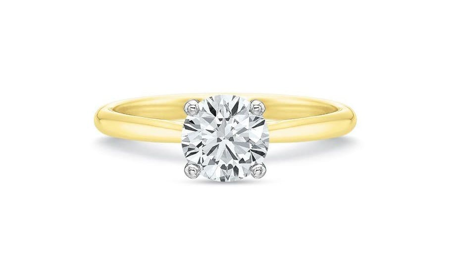 Engagement ring in 18K yellow gold and platinum featuring a 0.71ct round diamond solitaire