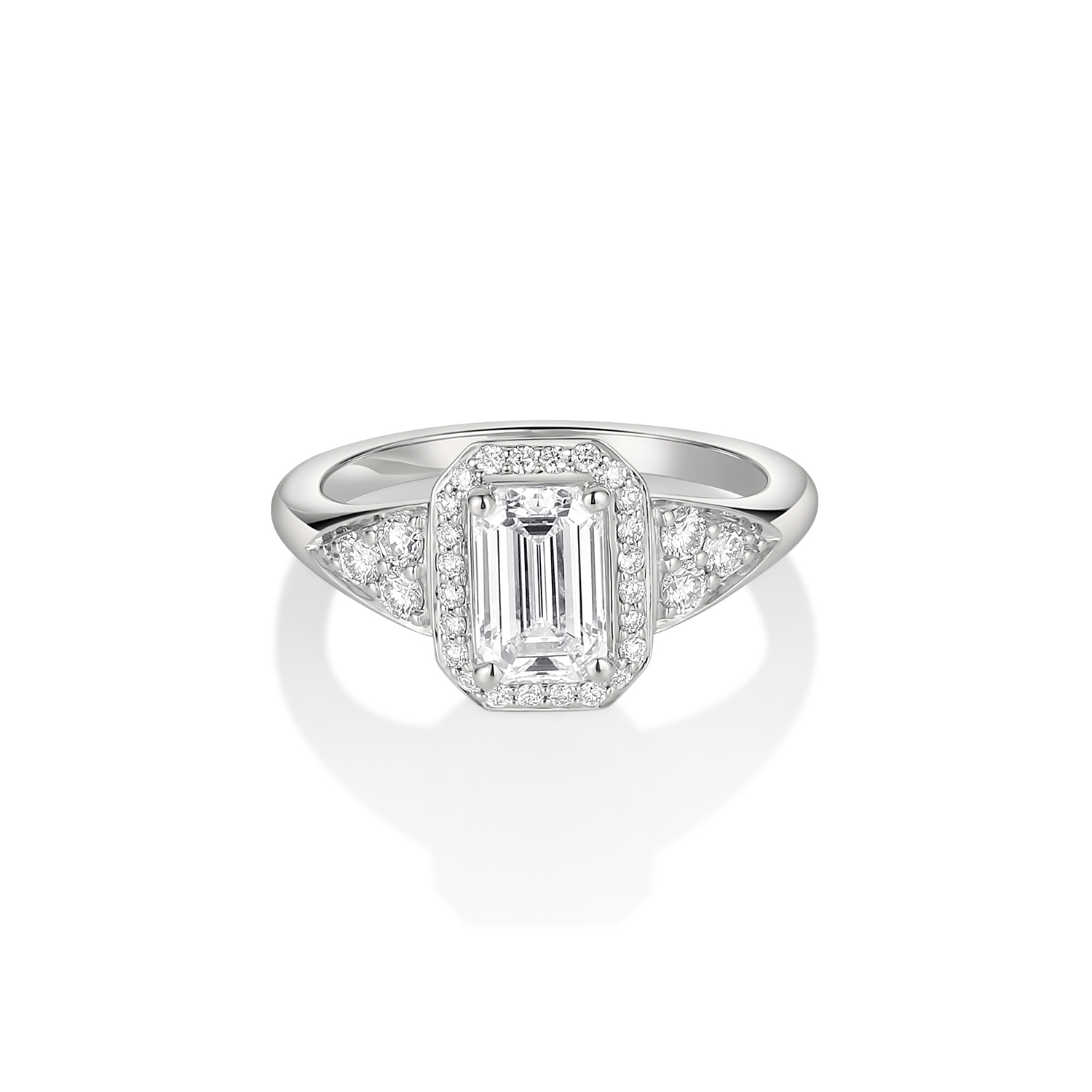 Platinum ring featuring a 1.05 carat emerald cut diamond with diamond halo and side trio diamond accents
