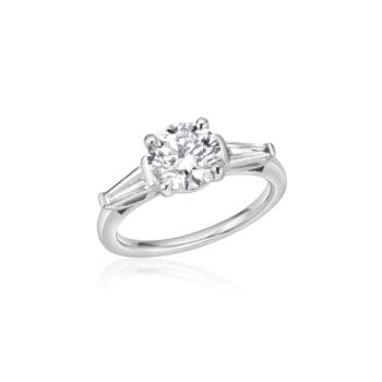 Platinum engagement ring with 1.62 carat round brilliant center diamond and tapered baguette diamond accents