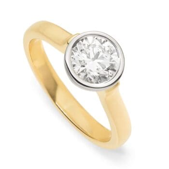 Floating diamond ring with 1.20ct round diamond bezel set in 14K yellow gold and platinum on finger size 7