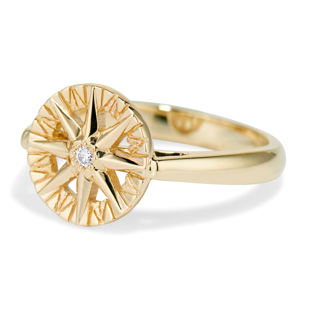 Compass Rose Ring featuring a round diamond set in 14K yellow gold