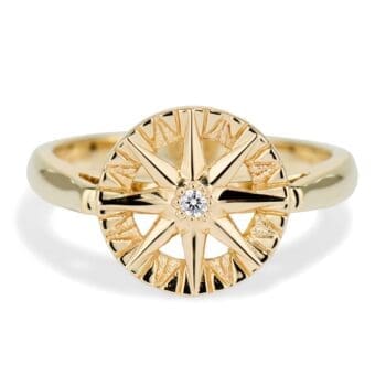 Compass Rose Ring featuring a round diamond set in 14K yellow gold