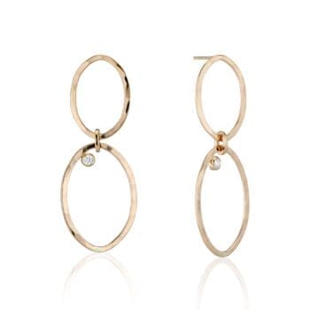 Handmade 14K yellow gold multi link earrings with bezel set round diamonds, displayed as post dangles