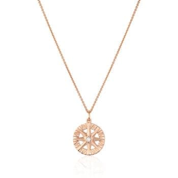 Compass Rose pendant featuring round diamond and side bead-set diamonds in 14K rose gold