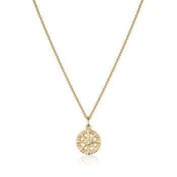 Compass Rose diamond pendant featuring a round diamond set in 14K yellow gold