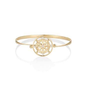 Compass Rose diamond spin bracelet in 14K yellow gold featuring five round diamonds in bead settings with a spinning compass design