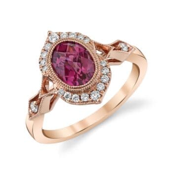 14K rose gold ring with oval rhodolite garnet center and diamond halo, size 7