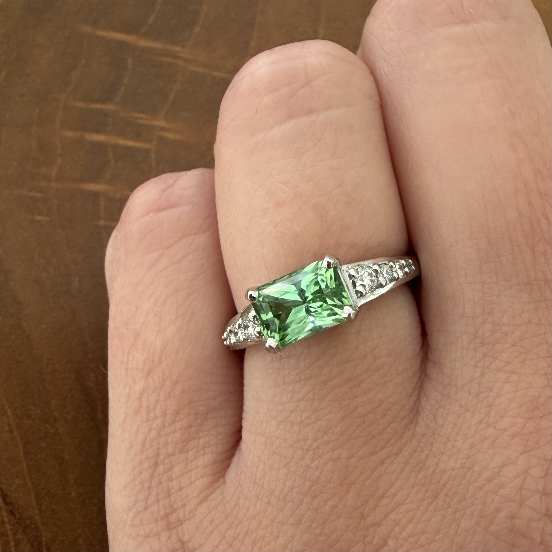 New Horizon ring featuring a mint green tourmaline and radiant cut diamonds set in platinum