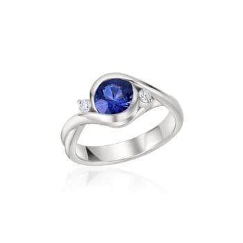 Petite Embrace Ring with blue sapphire center gemstone and round diamonds set in platinum, size 6.5