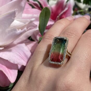 Watermelon Tourmaline halo ring with emerald cut diamonds in 18K yellow gold, size 7.25
