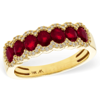 Anniversary ring featuring a red ruby and round diamonds set in 14K yellow gold