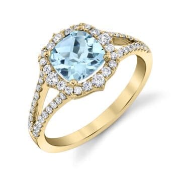 Aquamarine halo ring in 14K yellow gold with light blue aquamarine center and square cushion cut diamond accents