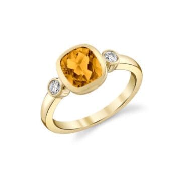 Yellow gold 3-stone ring with vibrant orange citrine center and elongated cushion cut diamond accents