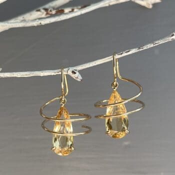 Pair of 14K yellow gold earrings with pear-shaped yellow topaz gemstones and French wire closure