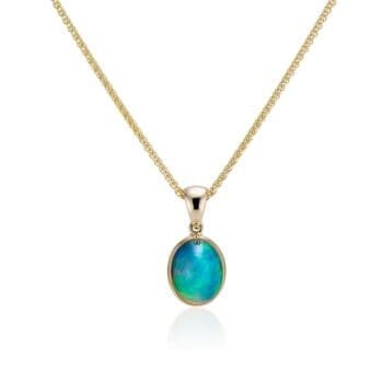Drop-shaped opal pendant in 14K yellow gold with four oval accent gemstones totaling 4.42 carats