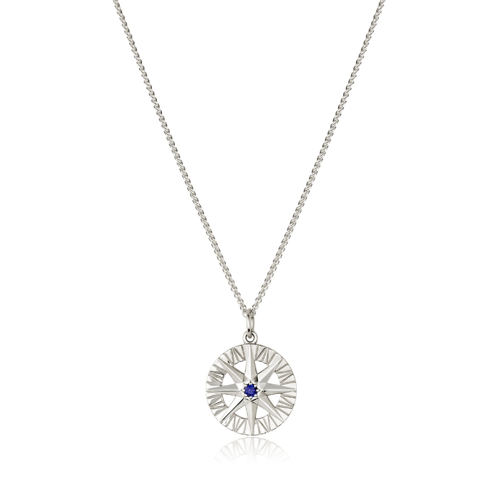 Compass Rose pendant featuring a blue sapphire center and round diamonds in 14K white gold