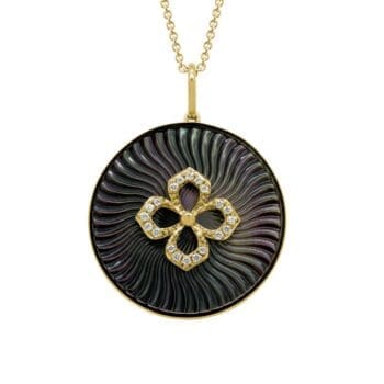 14K yellow gold pendant with black mother of pearl center surrounded by round diamonds