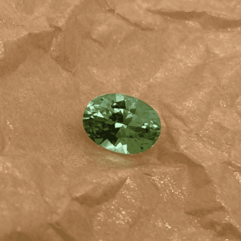 Oval mint green seasoned Maine tourmaline gemstone weighing 2.81 carats