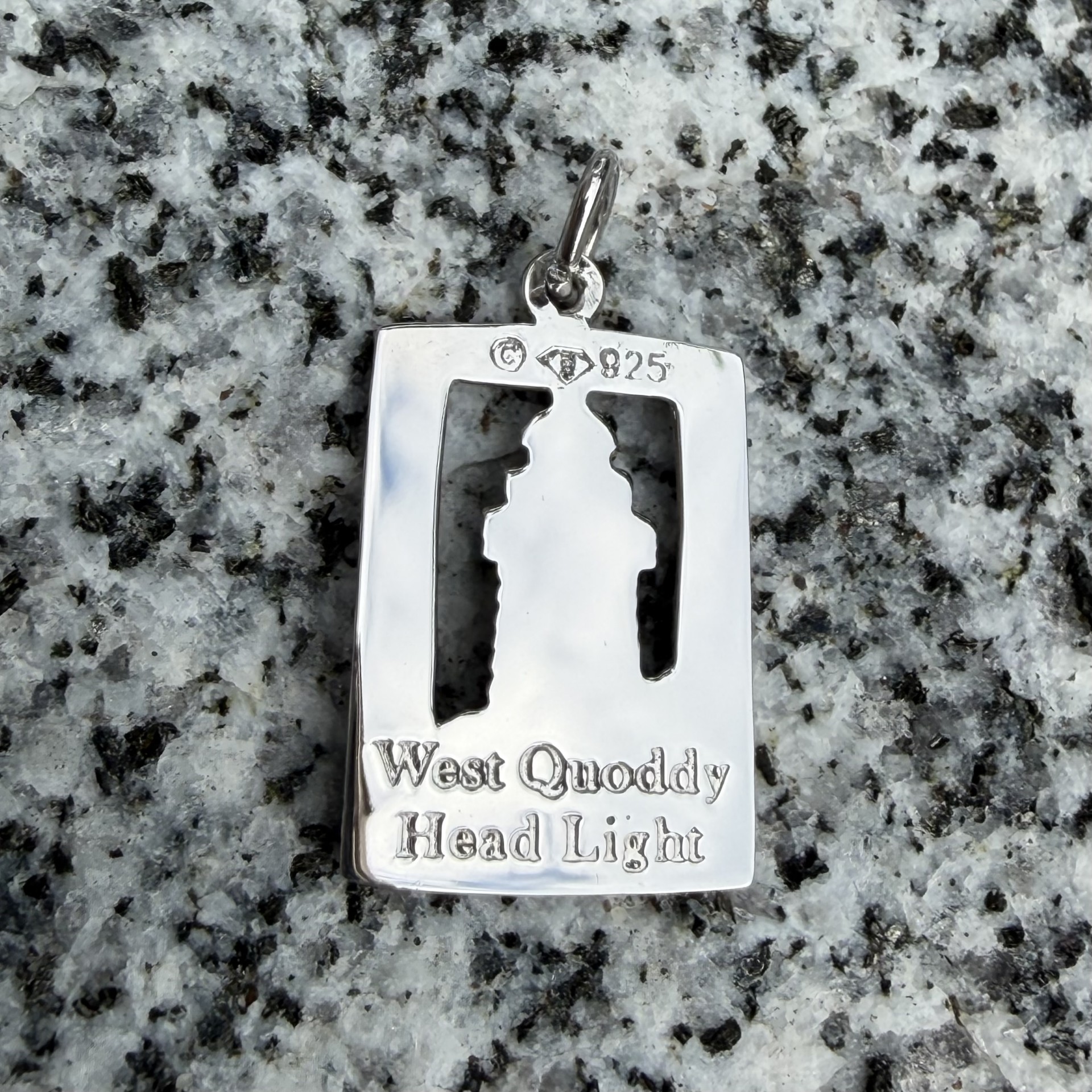 Sterling silver charm shaped as West Quoddy Lighthouse