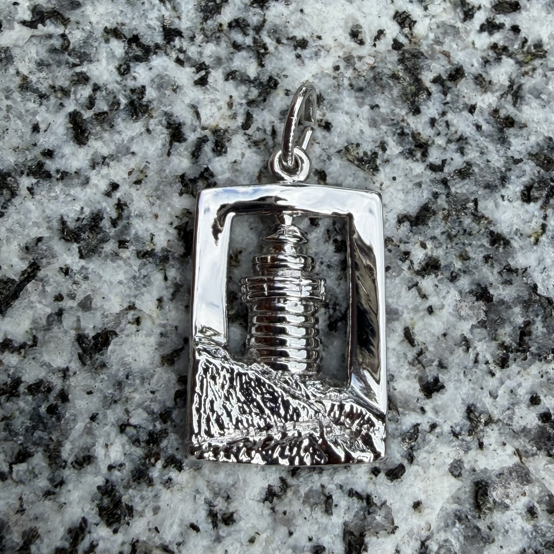 Sterling silver charm shaped as West Quoddy Lighthouse