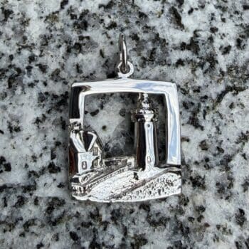 Sterling silver charm shaped like the Nubble Lighthouse
