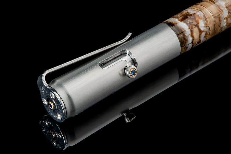 Bolt II Epic writing pen featuring fossil Woolly Mammoth tooth barrel and sapphire gemstone accents