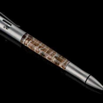 Bolt II Epic writing pen featuring fossil Woolly Mammoth tooth barrel and sapphire gemstone accents