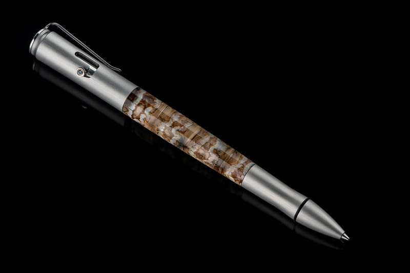 Bolt II Epic writing pen featuring fossil Woolly Mammoth tooth barrel and sapphire gemstone accents