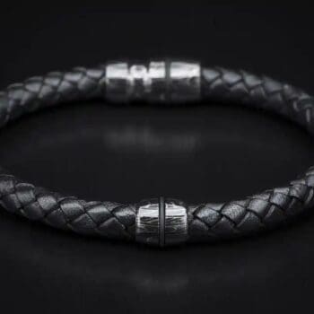 Jupiter bracelet featuring Damascus steel centerpiece and braided leather band